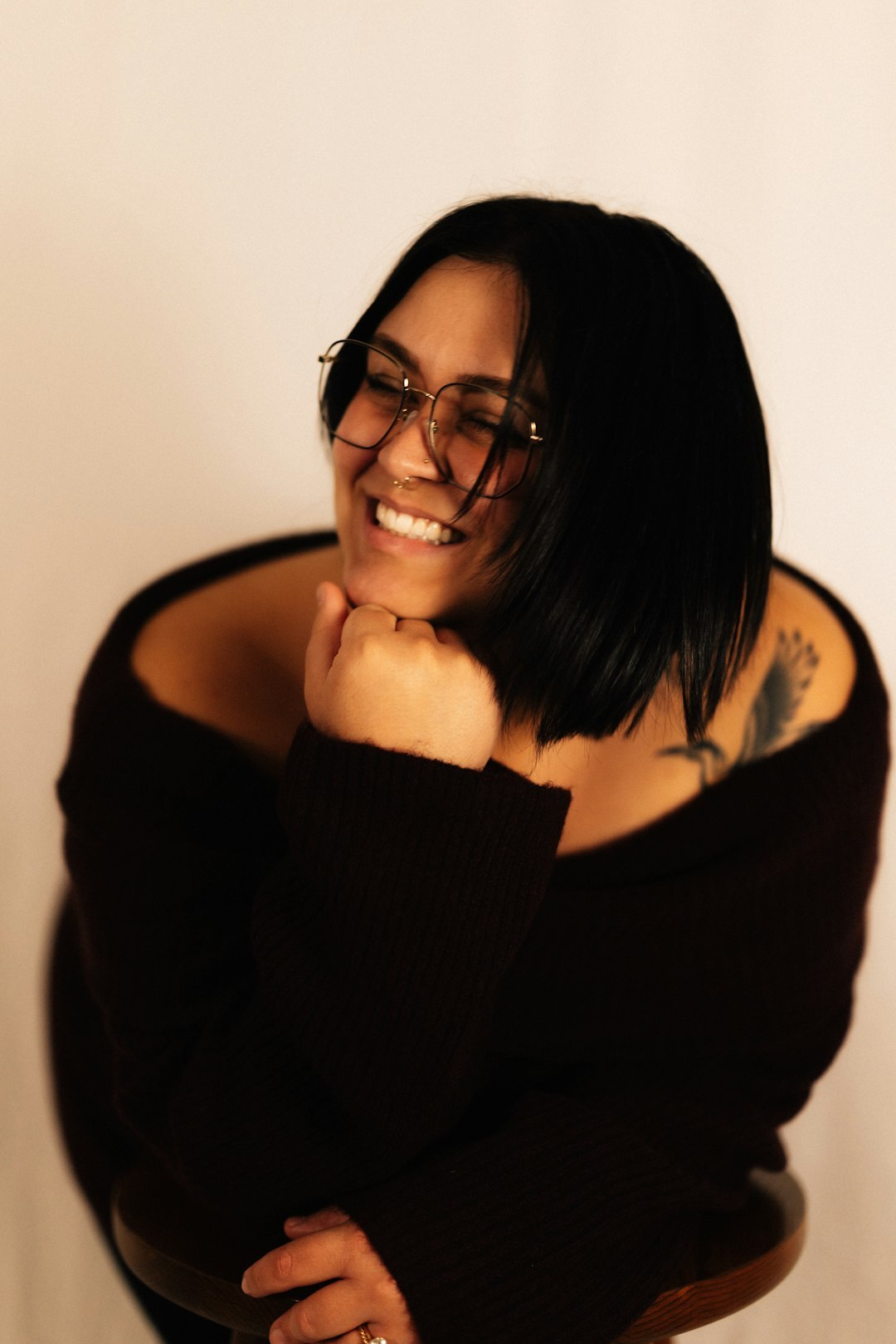 Studio portrait of a woman with short dark hair smiling