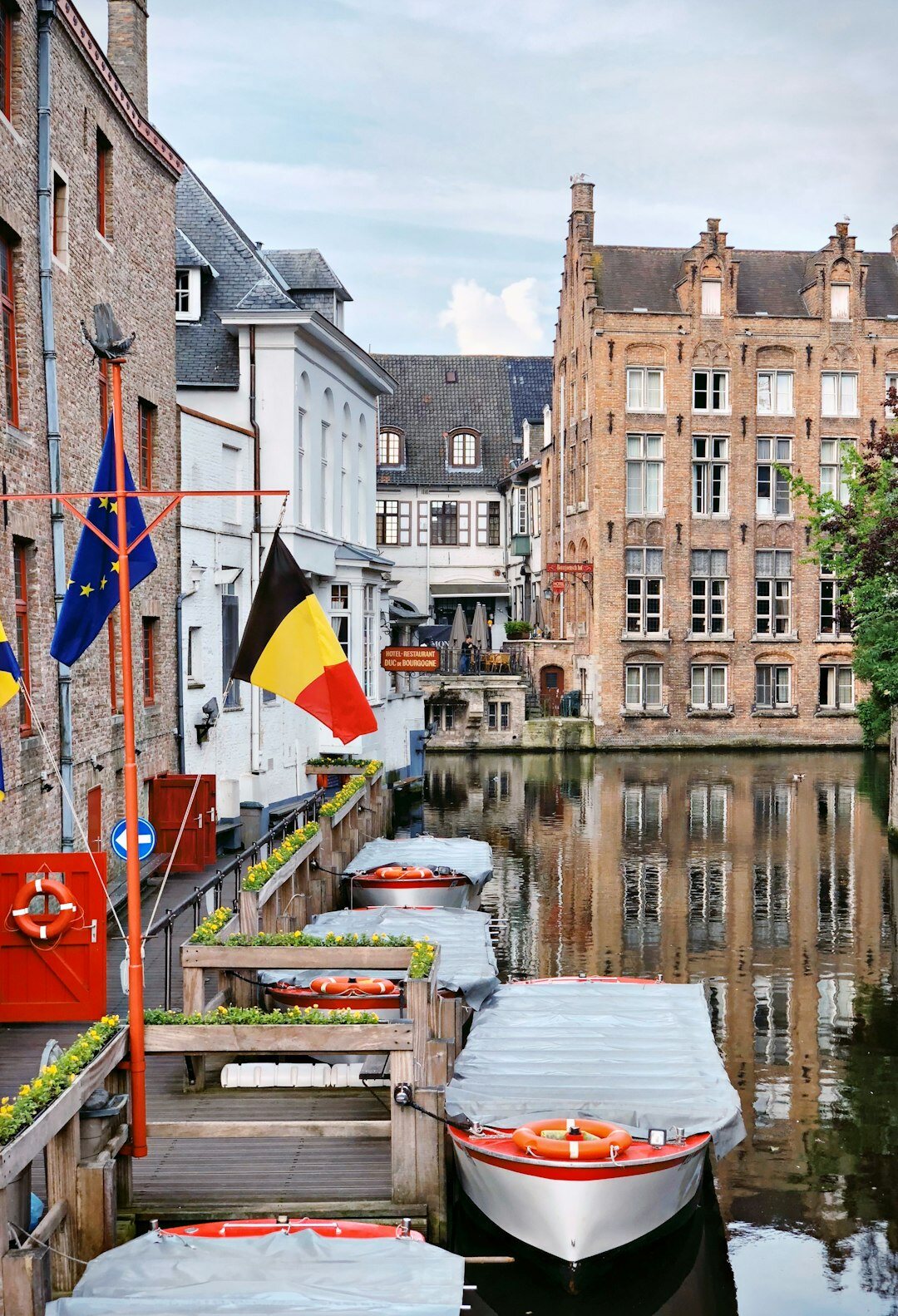 Row of classic Belgian townhouses along a canal